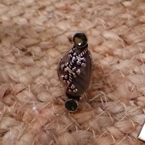 Tibetan silver ring with light green stones and a unknown marbelized stone